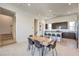 Open dining area with a modern table and chairs near the kitchen at 3346 Esker Ridge Ave, Henderson, NV 89044