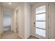 Inviting entryway with tile flooring and a modern front door with frosted glass panels at 3346 Esker Ridge Ave, Henderson, NV 89044