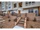 Townhome exterior with stone accents, brick steps, and sleek black railings at 3346 Esker Ridge Ave, Henderson, NV 89044