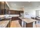 Modern kitchen with stainless appliances, granite countertops and island at 3346 Esker Ridge Ave, Henderson, NV 89044