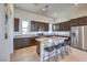 Stylish kitchen with granite countertops, stainless steel appliances, island with seating, and ample storage at 3346 Esker Ridge Ave, Henderson, NV 89044