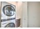 Convenient laundry area featuring stacked washer and dryer unit at 3346 Esker Ridge Ave, Henderson, NV 89044