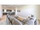 Open-concept living space with modern furnishings and an adjacent kitchen at 3346 Esker Ridge Ave, Henderson, NV 89044
