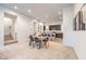 Spacious living area with stairs leading to the next level and kitchen with island in the background at 3346 Esker Ridge Ave, Henderson, NV 89044