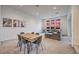 Bright living room features an open layout with dining area and sunset views through large windows at 3346 Esker Ridge Ave, Henderson, NV 89044
