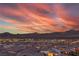 View of the residential neighborhood and mountain landscape during a colorful dusk at 3346 Esker Ridge Ave, Henderson, NV 89044
