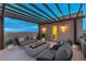 Relaxing rooftop patio featuring a fire pit, comfortable seating, and stunning city views at 3346 Esker Ridge Ave, Henderson, NV 89044