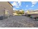 Spacious backyard featuring brick pavers, landscaping, and turf at 3386 W Haleh Ave, Las Vegas, NV 89141
