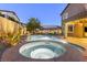 Backyard featuring a heated spa with stone surround and a built-in waterfall for outdoor fun and relaxation at 3386 W Haleh Ave, Las Vegas, NV 89141