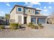 A well-maintained two-story home with stone accents, a three-car garage, and an inviting front yard at 3386 W Haleh Ave, Las Vegas, NV 89141