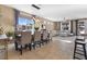 Bright living area features a dining table, tile floors, and backyard access at 3386 W Haleh Ave, Las Vegas, NV 89141