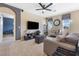 Relaxing living room with view, ceiling fan, and tile floors at 3386 W Haleh Ave, Las Vegas, NV 89141