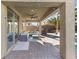 Covered patio with a ceiling fan, outdoor seating, and a view of the pool at 3386 W Haleh Ave, Las Vegas, NV 89141