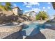 Relaxing pool and spa area with water features and palm trees, creating a serene outdoor oasis at 3386 W Haleh Ave, Las Vegas, NV 89141