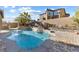 Inviting pool area with waterfalls, stone accents, and a spacious patio, ideal for relaxation and entertainment at 3386 W Haleh Ave, Las Vegas, NV 89141