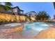 Relaxing backyard pool and hot tub featuring a stone surround and water feature for outdoor entertaining at 3386 W Haleh Ave, Las Vegas, NV 89141