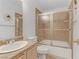 Cozy bathroom with sink, toilet, and shower-tub combo with glass doors at 3660 Renovah St # 204, Las Vegas, NV 89129