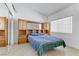 Bright bedroom featuring a bed and storage unit at 3660 Renovah St # 204, Las Vegas, NV 89129