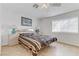 Cozy bedroom featuring large window and fan at 3660 Renovah St # 204, Las Vegas, NV 89129