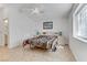 Bright bedroom with tile floors, ceiling fan, and natural light from the window at 3660 Renovah St # 204, Las Vegas, NV 89129