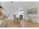 Bright dining area with tile floors, chandelier, and glass table for a light and airy space at 3660 Renovah St # 204, Las Vegas, NV 89129