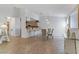 Dining area boasts chandelier and bar seating, connecting to a modern kitchen at 3660 Renovah St # 204, Las Vegas, NV 89129