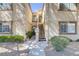 Exterior of the condo building, featuring a private entry with a stairway and landscaped grounds at 3660 Renovah St # 204, Las Vegas, NV 89129
