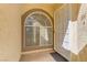 Inviting front entrance with security door and decorative window providing natural light at 3660 Renovah St # 204, Las Vegas, NV 89129