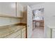 Charming kitchen featuring neutral cabinets and stone countertops at 3660 Renovah St # 204, Las Vegas, NV 89129