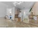 Bright kitchen featuring granite countertops and access to laundry and additional rooms at 3660 Renovah St # 204, Las Vegas, NV 89129