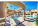 Community pool and spa with shade structures at 3660 Renovah St # 204, Las Vegas, NV 89129