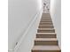 Carpeted staircase leading to the upper level at 3660 Renovah St # 204, Las Vegas, NV 89129