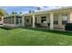 Lush backyard featuring a covered patio area, providing an ideal spot for outdoor enjoyment at 3684 Miguels Ln, Las Vegas, NV 89120