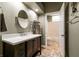 Updated bathroom with vanity, mirror and neutral paint at 3684 Miguels Ln, Las Vegas, NV 89120