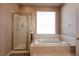 Bathroom with large tub and glass enclosed shower at 3684 Miguels Ln, Las Vegas, NV 89120