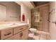 Bathroom featuring a shower, toilet, and vanity with a sink at 3684 Miguels Ln, Las Vegas, NV 89120