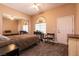 Cozy bedroom with mirrored closets and a large window at 3684 Miguels Ln, Las Vegas, NV 89120