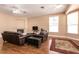 Spacious living room with hardwood floors, fireplace, and ample natural light at 3684 Miguels Ln, Las Vegas, NV 89120