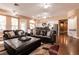 Bright, open living room with hardwood floors and an eat-in kitchen with stainless steel appliances at 3684 Miguels Ln, Las Vegas, NV 89120