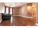 Cozy living room featuring hardwood floors and a built-in illuminated display niche at 3684 Miguels Ln, Las Vegas, NV 89120