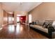 Open-concept living room with hardwood floors and access to the dining area at 3684 Miguels Ln, Las Vegas, NV 89120