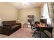 Office with carpet flooring, desk, and couch at 3684 Miguels Ln, Las Vegas, NV 89120