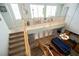 Bright, carpeted staircase leads to an upstairs landing with a light fixture, showcasing the home's open floor plan at 3721 Moonshine Falls Ave, North Las Vegas, NV 89085