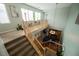 Bright, carpeted staircase leads to an upstairs landing with a light fixture, showcasing the home's open floor plan at 3721 Moonshine Falls Ave, North Las Vegas, NV 89085