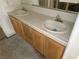 Bathroom vanity with double sinks and a tiled countertop, providing ample space and functionality at 3761 Tohono Canyon St, Las Vegas, NV 89147