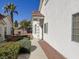 The exterior side of the home showcases meticulous landscaping and easy access to the front door at 3761 Tohono Canyon St, Las Vegas, NV 89147