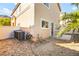 The back of the house with AC units, block wall and partial landscape at 3920 Beverly Elms St, Las Vegas, NV 89129