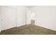 Bedroom featuring closet, neutral carpet, light walls, and a doorway at 3920 Beverly Elms St, Las Vegas, NV 89129