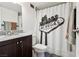 Compact bathroom featuring a vanity and a shower with a Las Vegas-themed curtain at 3930 University Center Dr # 804, Las Vegas, NV 89119