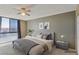 Comfortable bedroom featuring a large window with views, a modern bed, and natural light at 3930 University Center Dr # 804, Las Vegas, NV 89119